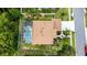 Aerial view of home featuring a screened in pool and manicured yard at 1324 Tall Maple Loop, Oviedo, FL 32765