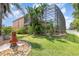 Green backyard and landscaping at 1324 Tall Maple Loop, Oviedo, FL 32765