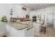 Bright kitchen with granite countertops, stainless appliances, and a breakfast bar with seating at 1324 Tall Maple Loop, Oviedo, FL 32765