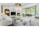 Cozy living room with a fireplace, built-in shelving, and sliding glass doors to the outdoor patio at 1324 Tall Maple Loop, Oviedo, FL 32765