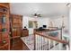Home office with custom built-in bookcase and hardwood floors at 1324 Tall Maple Loop, Oviedo, FL 32765