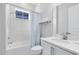 Bright bathroom features a shower/tub combo, and a stylish vanity at 13800 Chauvin Ave, Orlando, FL 32827