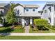 Charming two-story home with a manicured front yard, walkway, and beautiful landscaping at 13800 Chauvin Ave, Orlando, FL 32827