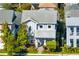 Charming two-story home with a manicured front yard, walkway, and beautiful landscaping at 13800 Chauvin Ave, Orlando, FL 32827