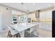 Bright kitchen with white cabinets, center island, and stainless steel range hood at 13800 Chauvin Ave, Orlando, FL 32827
