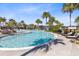 Beautiful pool with palm trees and inviting lounge chairs for relaxation and leisure at 13800 Chauvin Ave, Orlando, FL 32827