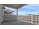 This cozy outdoor balcony offers a comfortable place to sit and enjoy the fresh air and sunshine at 13809 Luna Harvest Ave, Winter Garden, FL 34787