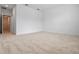 This spacious carpeted bedroom is painted with neutral colors and has a light fixture at 13809 Luna Harvest Ave, Winter Garden, FL 34787