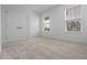 This minimalist bedroom has neutral walls, plush carpet, and sun-filled windows at 13809 Luna Harvest Ave, Winter Garden, FL 34787