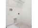 This bright laundry room features tiled floors, white walls, and has all the hookups needed at 13809 Luna Harvest Ave, Winter Garden, FL 34787