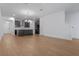 Spacious open-concept living area featuring modern kitchen with island and light-filled dining space at 13809 Luna Harvest Ave, Winter Garden, FL 34787