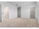 Spacious primary bedroom with neutral carpet, walk-in closet, and ensuite bathroom at 13809 Luna Harvest Ave, Winter Garden, FL 34787