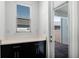 Mud room with a storage cabinet topped with white countertop, and a window for plenty of natural light at 13809 Luna Harvest Ave, Winter Garden, FL 34787