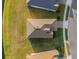 Overhead view of a home, showcasing the roof, driveway, landscaping, and proximity to the sidewalk at 1452 Hopedale Pl, Sanford, FL 32771