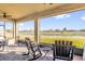 This screened-in back porch features a view of the adjacent pond at 1452 Hopedale Pl, Sanford, FL 32771