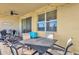 This covered back porch features a ceiling fan and brick flooring at 1452 Hopedale Pl, Sanford, FL 32771