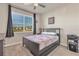 Bedroom featuring a bed, ceiling fan, and a large window with neighborhood views at 1452 Hopedale Pl, Sanford, FL 32771