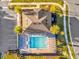 Aerial view of a community pool with lounge chairs, parking, landscaping, and walking path at 1452 Hopedale Pl, Sanford, FL 32771