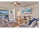 Comfortable living room featuring a ceiling fan and sliding glass doors at 1452 Hopedale Pl, Sanford, FL 32771