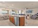 Spacious living area with kitchen island, dining area, and comfortable seating at 1452 Hopedale Pl, Sanford, FL 32771