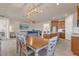 Open living space with kitchen island, dining area, and comfortable living room at 1452 Hopedale Pl, Sanford, FL 32771