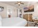This main bedroom features a ceiling fan, large dresser, and a TV at 1452 Hopedale Pl, Sanford, FL 32771
