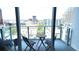 Balcony with a table and chairs offering spectacular downtown city views at 150 E Robinson St # 12A-15 / 1216, Orlando, FL 32801
