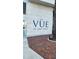 A closer view of The Vue at Lake Eola brick sign with palm tree near the building's corner at 150 E Robinson St # 12A-15 / 1216, Orlando, FL 32801