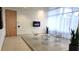 Modern lobby with stylish chairs, TV, large windows and natural light at 150 E Robinson St # 12A-15 / 1216, Orlando, FL 32801