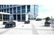 Spacious rooftop deck featuring comfortable seating, dining areas, and lush green planters at 150 E Robinson St # 12A-15 / 1216, Orlando, FL 32801