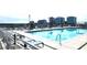 Enjoy a refreshing swim in the rooftop pool with panoramic views and convenient poolside seating at 150 E Robinson St # 12A-15 / 1216, Orlando, FL 32801
