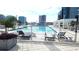 Relax in the luxurious rooftop pool with stunning city views and comfortable lounge seating at 150 E Robinson St # 12A-15 / 1216, Orlando, FL 32801