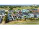 Stunning aerial view of a home with a pool overlooking a golf course at 1543 Corolla Ct, Reunion, FL 34747