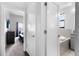 Bright bathroom featuring modern fixtures, a soaking tub, and neutral tones at 1543 Corolla Ct, Reunion, FL 34747
