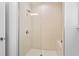 Clean and modern bathroom features a glass-enclosed shower with bright, neutral tile at 1543 Corolla Ct, Reunion, FL 34747