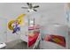 Charming bedroom with bunk beds, colorful decor, and whimsical princess-themed accents at 1543 Corolla Ct, Reunion, FL 34747