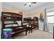 Fun ' bedroom with Star Wars decor, bunk beds, and a ceiling fan at 1543 Corolla Ct, Reunion, FL 34747