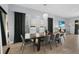 Dining room features a dark wood table, six chairs, chandelier and a view at 1543 Corolla Ct, Reunion, FL 34747
