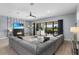 Comfortable living room featuring a modern fireplace, stylish decor, and access to a lovely outdoor patio at 1543 Corolla Ct, Reunion, FL 34747