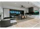 Covered patio with outdoor kitchen and dining area perfect for entertaining at 1543 Corolla Ct, Reunion, FL 34747