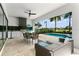 Inviting outdoor space with a pool, grill, TV, and seating area, perfect for entertaining at 1543 Corolla Ct, Reunion, FL 34747
