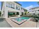 Gorgeous pool area with spa, outdoor kitchen and patio with lounge chairs at 1543 Corolla Ct, Reunion, FL 34747