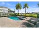 Inviting pool and spa area with lounge chairs overlooking the golf course at 1543 Corolla Ct, Reunion, FL 34747