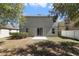 Backyard featuring a lawn with mature trees and a patio area at 16217 Saint Augustine St, Clermont, FL 34714