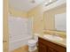 Standard bathroom with a combined tub and shower unit and neutral-toned walls at 16217 Saint Augustine St, Clermont, FL 34714