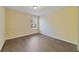 Neutral bedroom featuring hardwood floors and a window at 16217 Saint Augustine St, Clermont, FL 34714