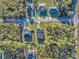 Drone shot of a new construction home with manicured lawn and black roof at 17135 Sw 41 Ct, Ocala, FL 34473