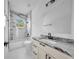 Modern bathroom with a tub-shower combo and an updated vanity with solid surface counter at 17135 Sw 41 Ct, Ocala, FL 34473