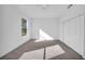 Well-lit bedroom boasts soft carpet, and a closet for your wardrobe and personal items at 17135 Sw 41 Ct, Ocala, FL 34473