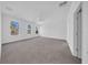 Spacious bedroom features three bright windows, neutral carpet and a ceiling fan at 17135 Sw 41 Ct, Ocala, FL 34473
